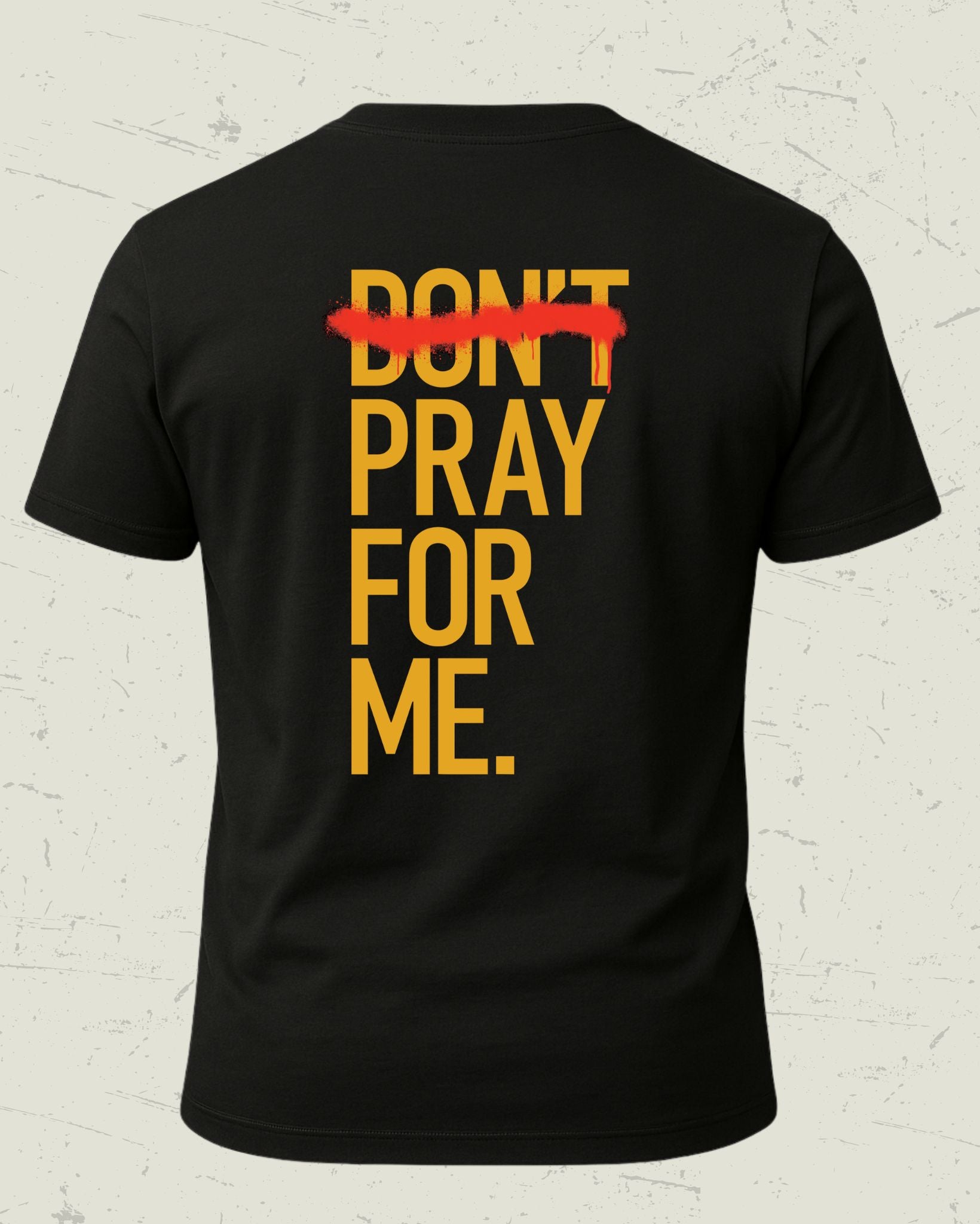 Black t-shirt with yellow text 'DON'T PRAY FOR ME' on a textured white background
