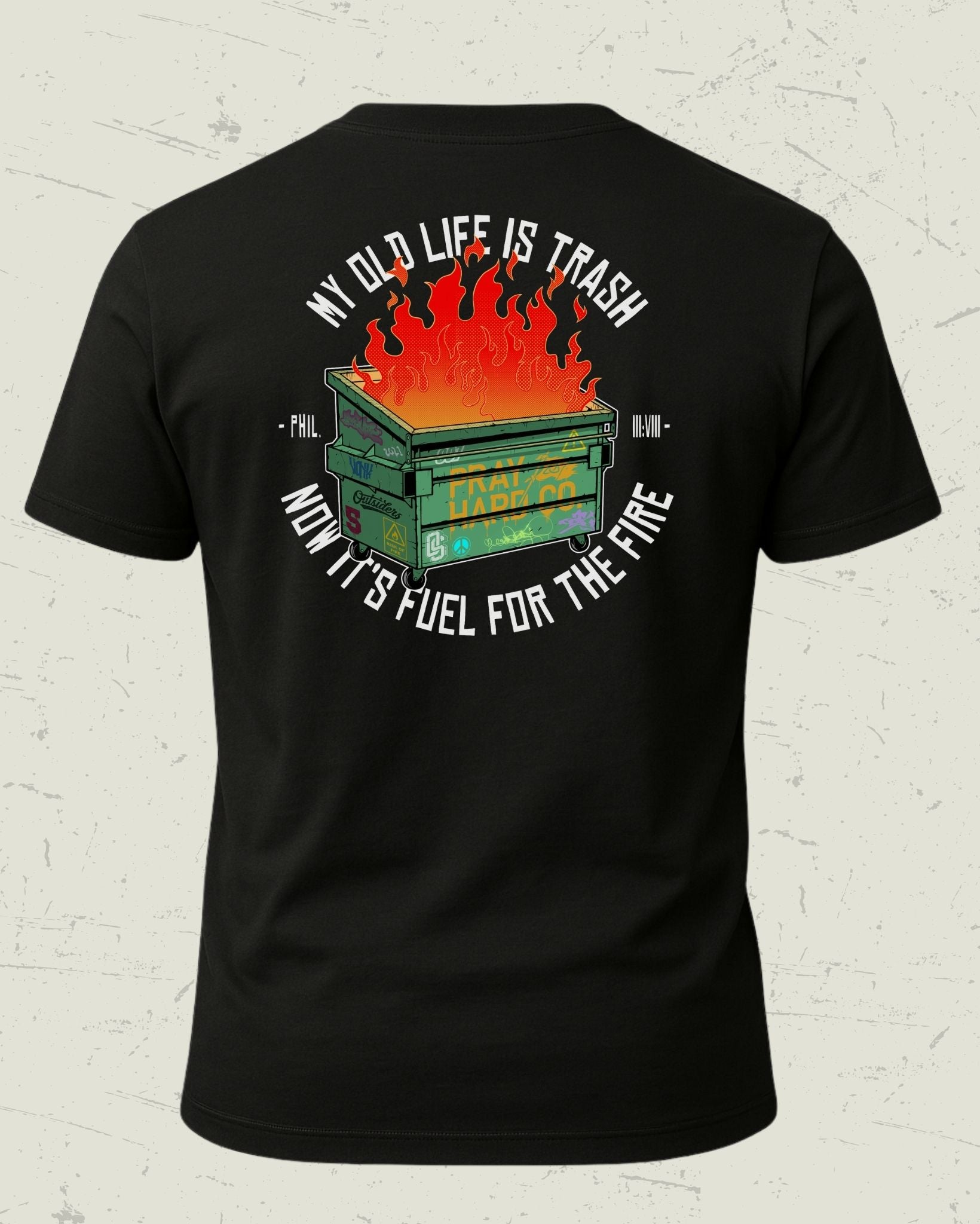 Black t-shirt with graphic design and text on a textured white background