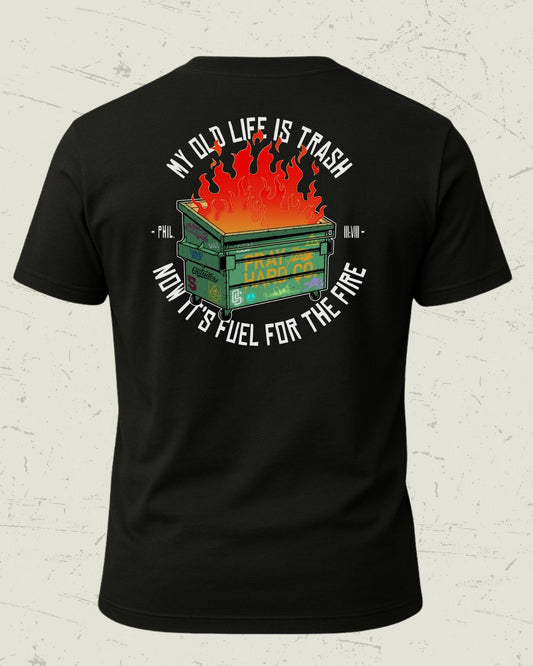 Black t-shirt with graphic design and text on a textured white background